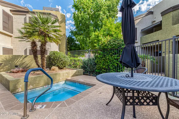a view of a house with swimming pool and porch