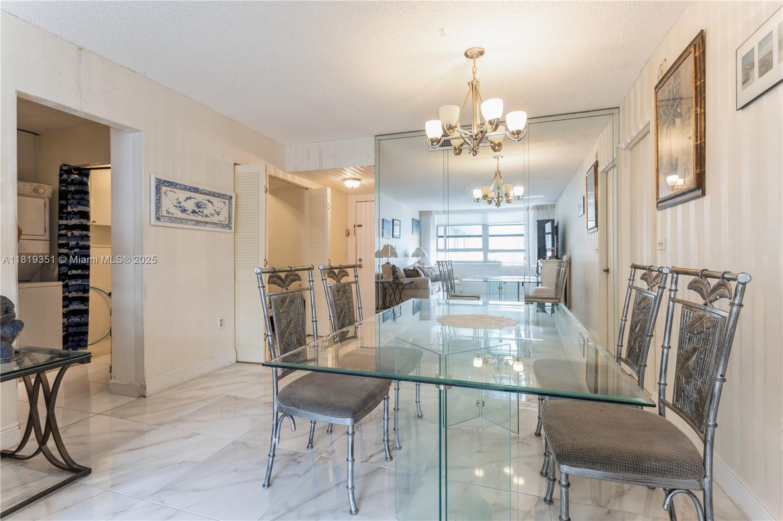 9273 Collins Avenue, Unit 1101 Surfside, FL 33154 - Photo 11 of 22 a view of a dining room with furniture