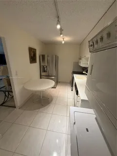 a bathroom with a sink toilet and mirror