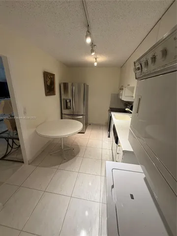 a bathroom with a sink toilet and mirror