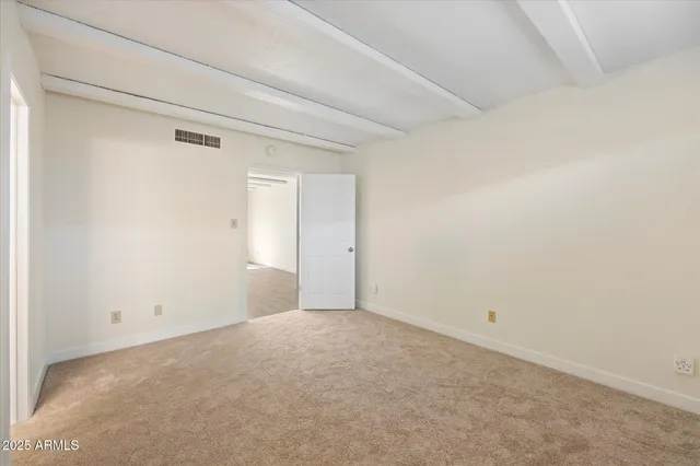 a bathroom with a bath tub with a shower