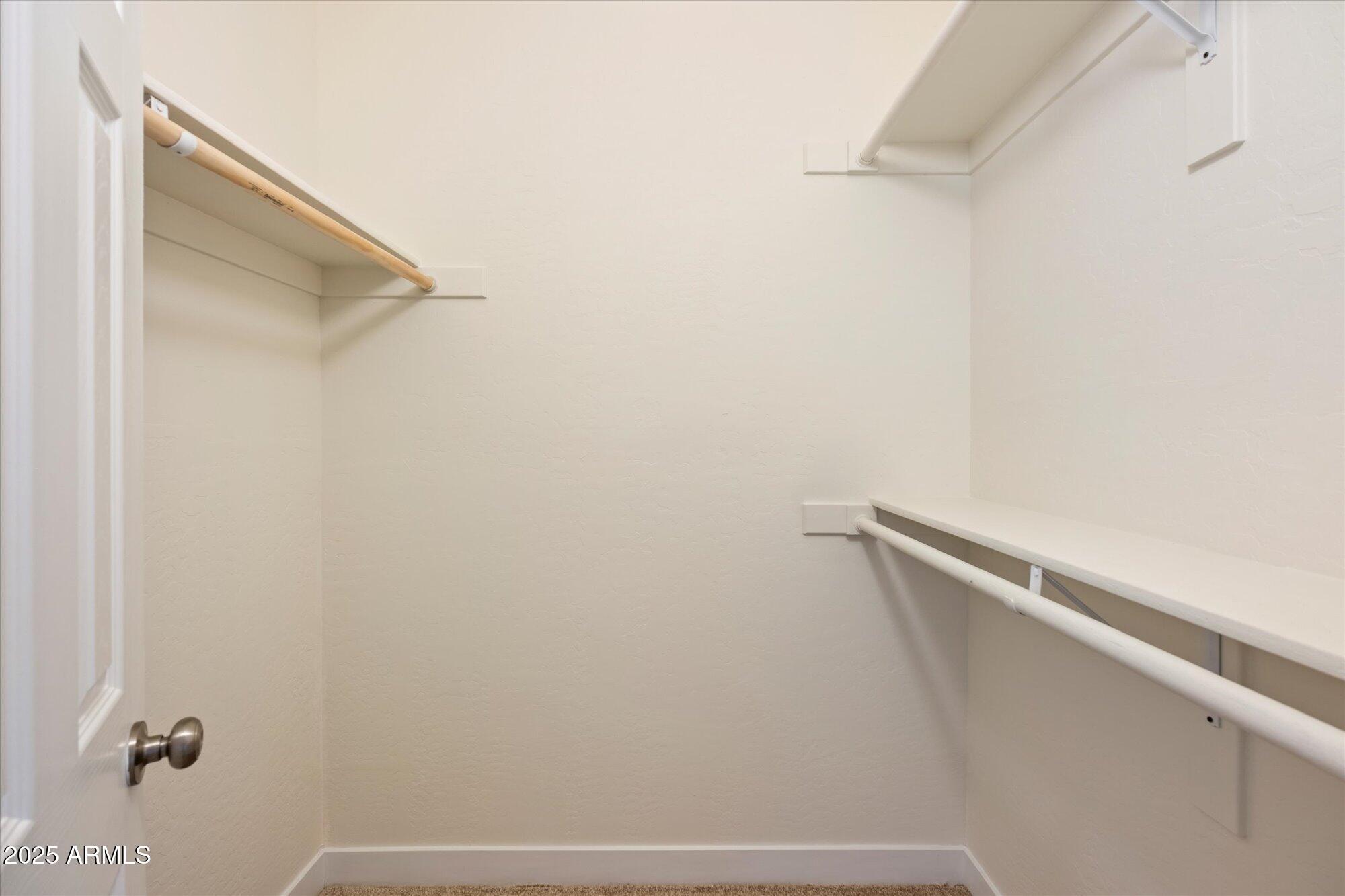 1014 East Osborn Road, Unit A Phoenix, AZ 85014 - Photo 16 of 25 a view of a closet with racks on the wall