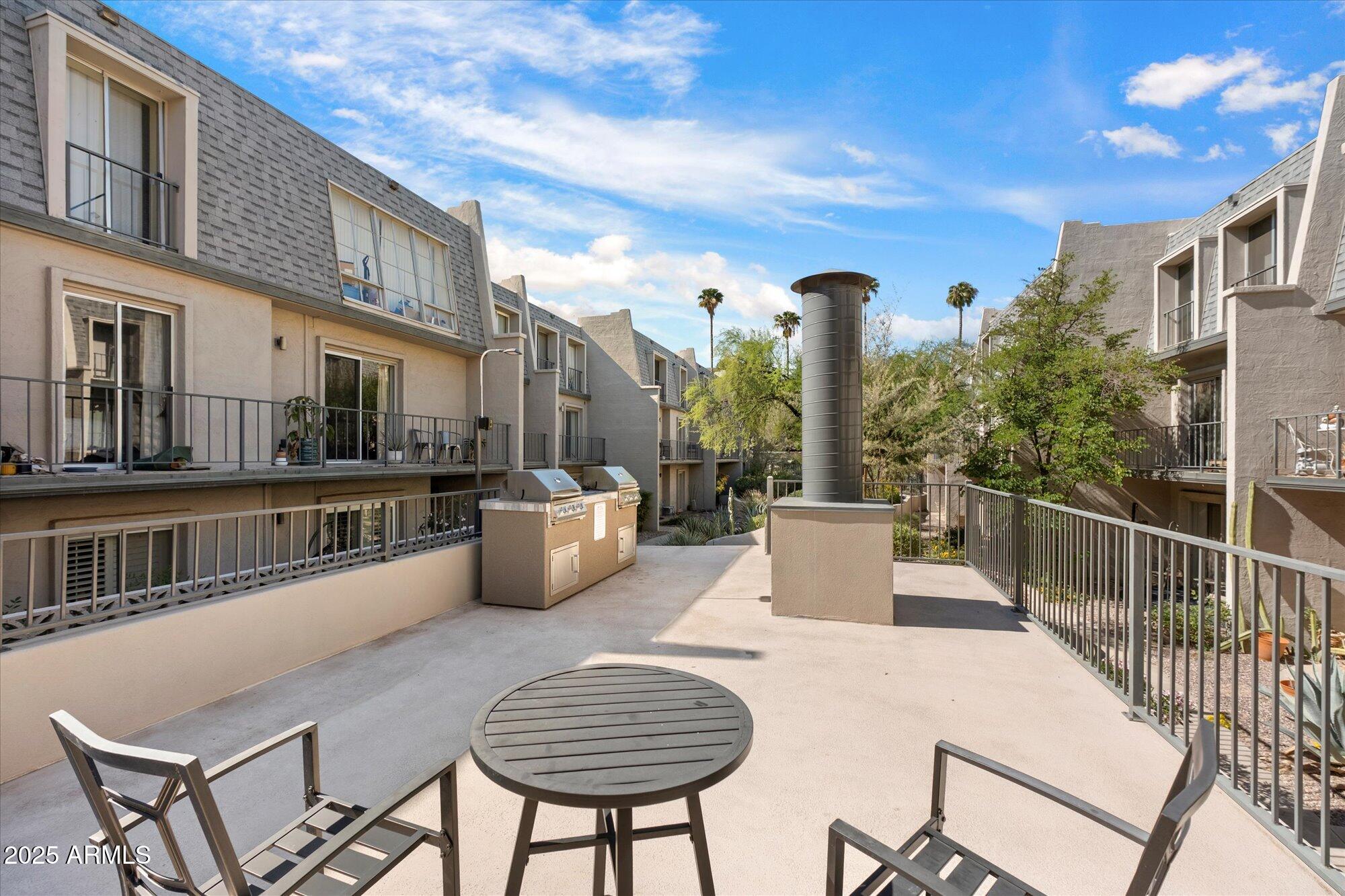 1014 East Osborn Road, Unit A Phoenix, AZ 85014 - Photo 20 of 25 a view of a patio with couches table and chairs