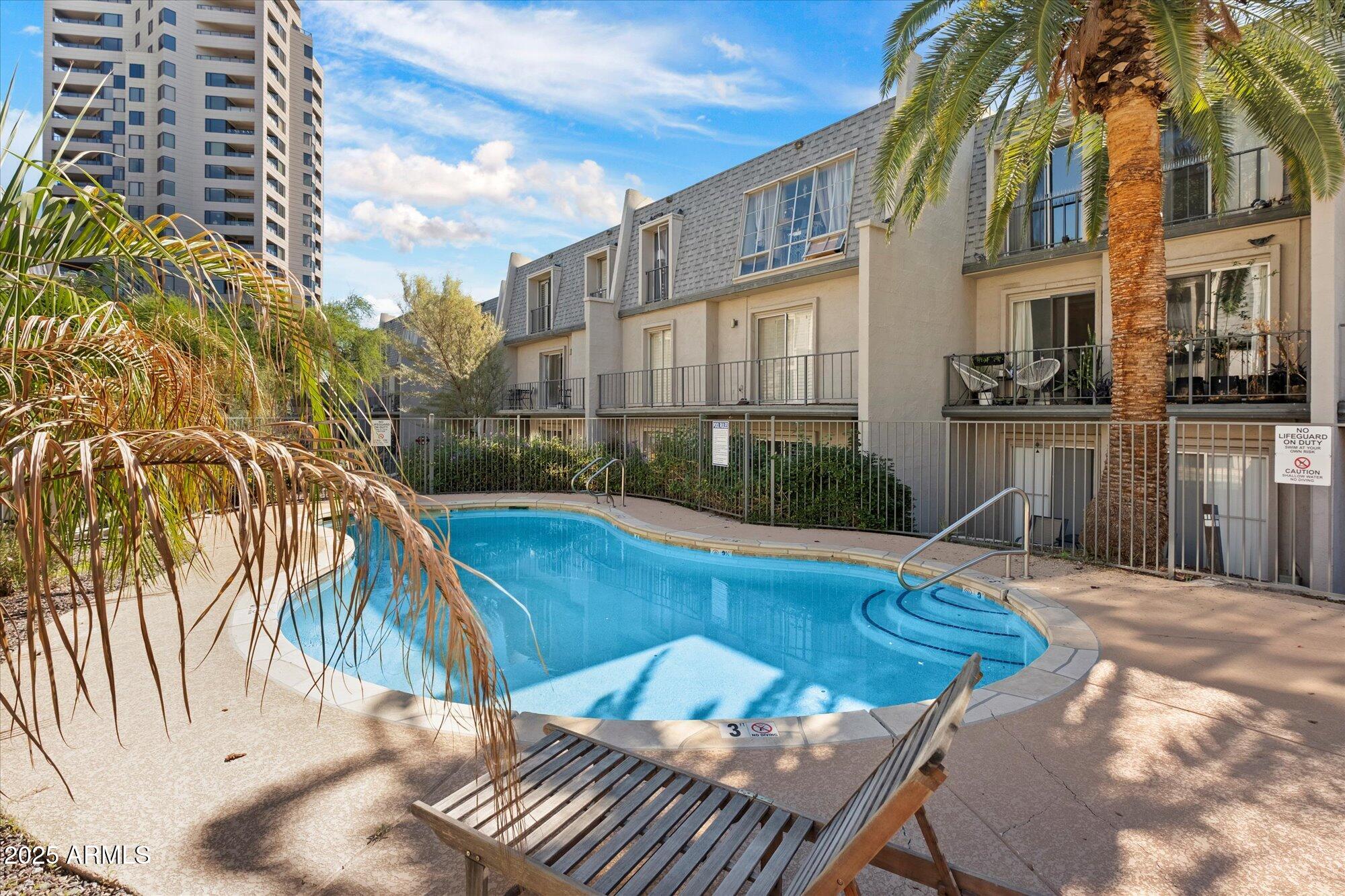 1014 East Osborn Road, Unit A Phoenix, AZ 85014 - Photo 22 of 25 a view of a house with swimming pool