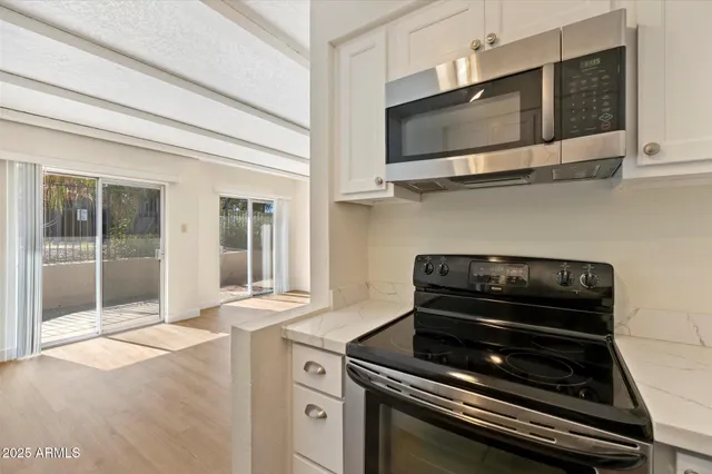 a kitchen with a stove and a microwave