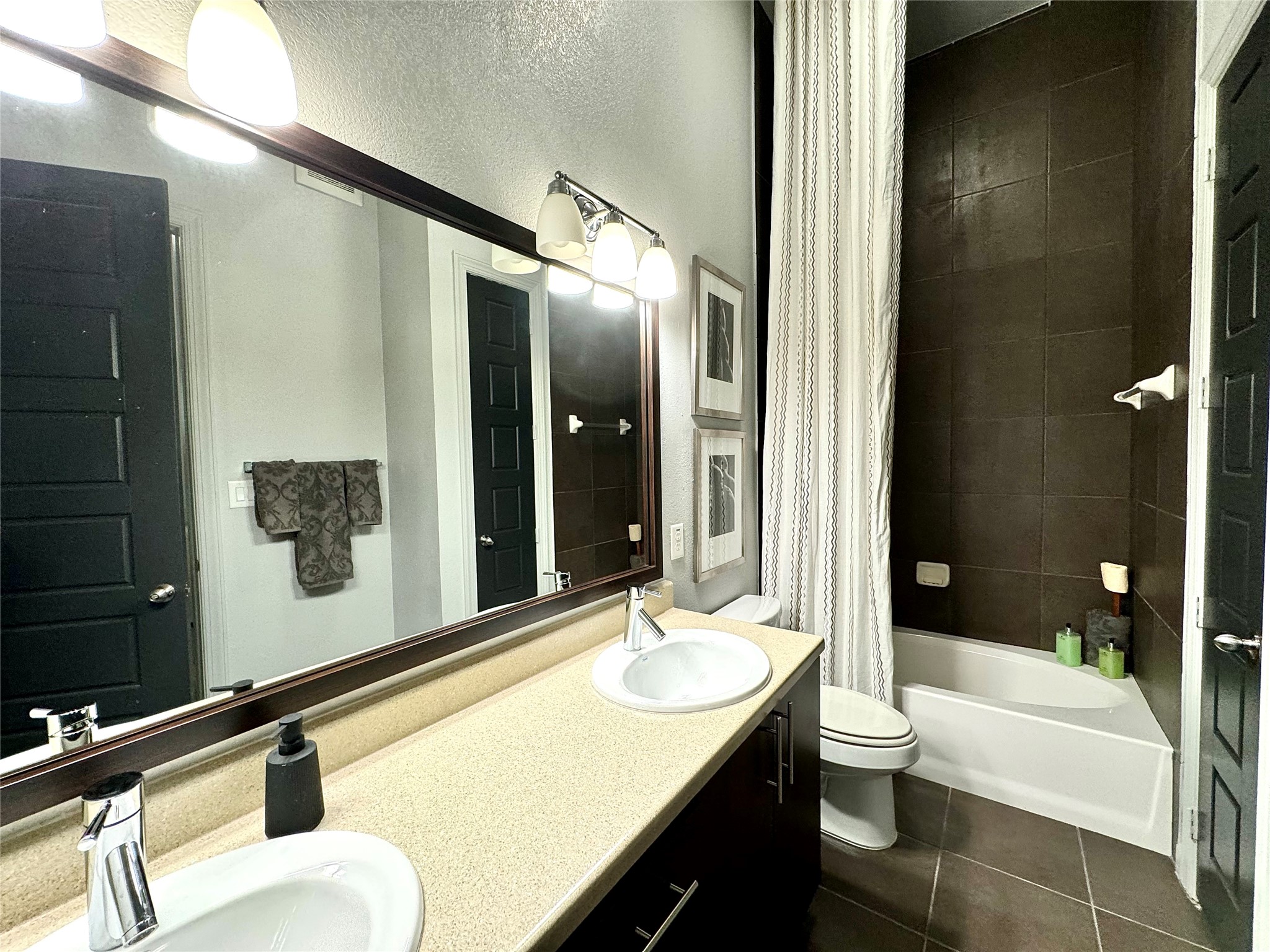 2525 McCue Road, Unit 249 Houston, TX 77056 - Photo 11 of 13 a bathroom with a granite countertop sink and a mirror