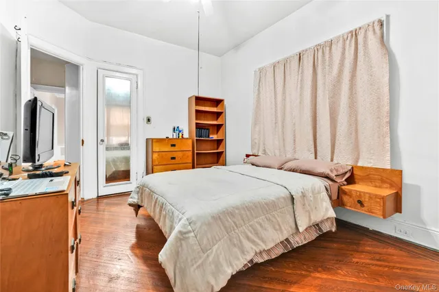 a bed room with a bed and a television