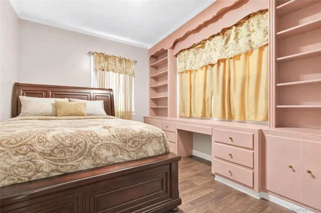 a kitchen with a white stove top oven and cabinets