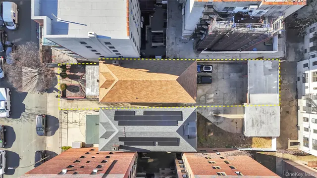 a street sign on a brick wall next to a building