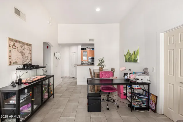 a room with a wooden floor and furniture