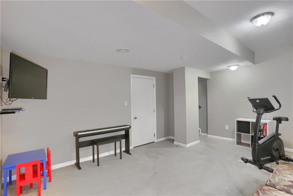 127 Shenot Road Wexford, PA 15090 - Photo 46 of 49 Lower level gameroom with entrance to the garage.