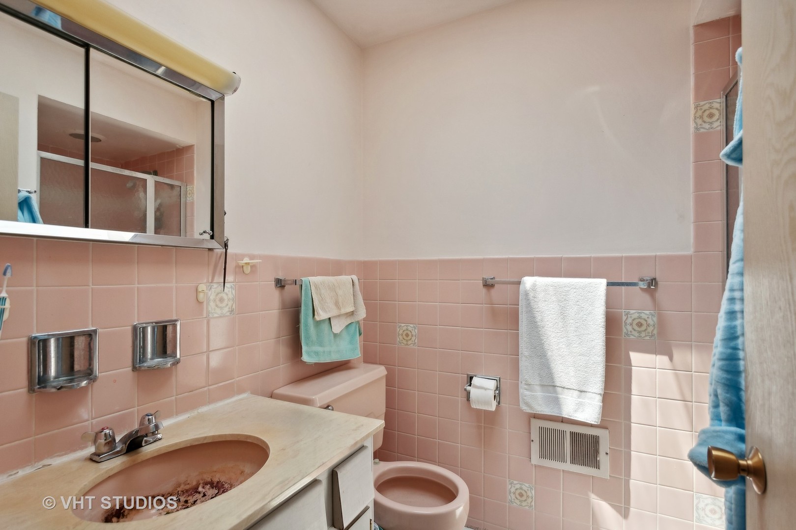7957 Beckwith Road Morton Grove, IL 60053 - Photo 14 of 26 a bathroom with a sink and a mirror