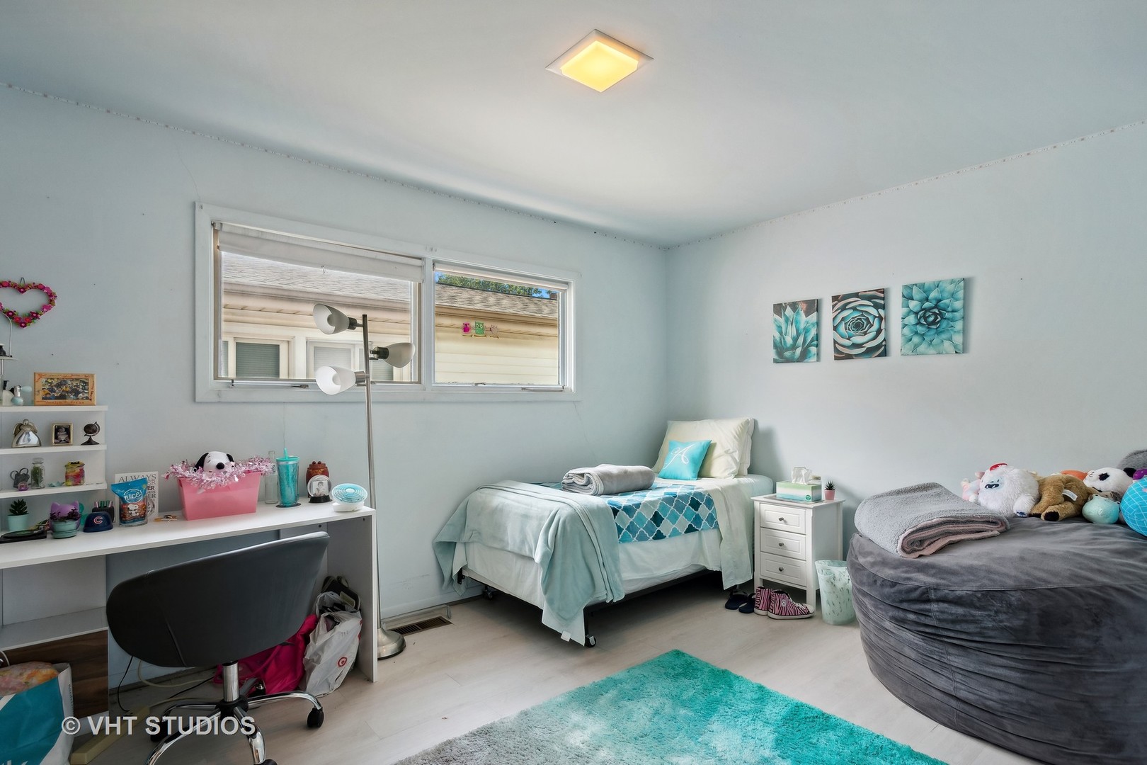 7957 Beckwith Road Morton Grove, IL 60053 - Photo 15 of 26 a bedroom with a bed and a window