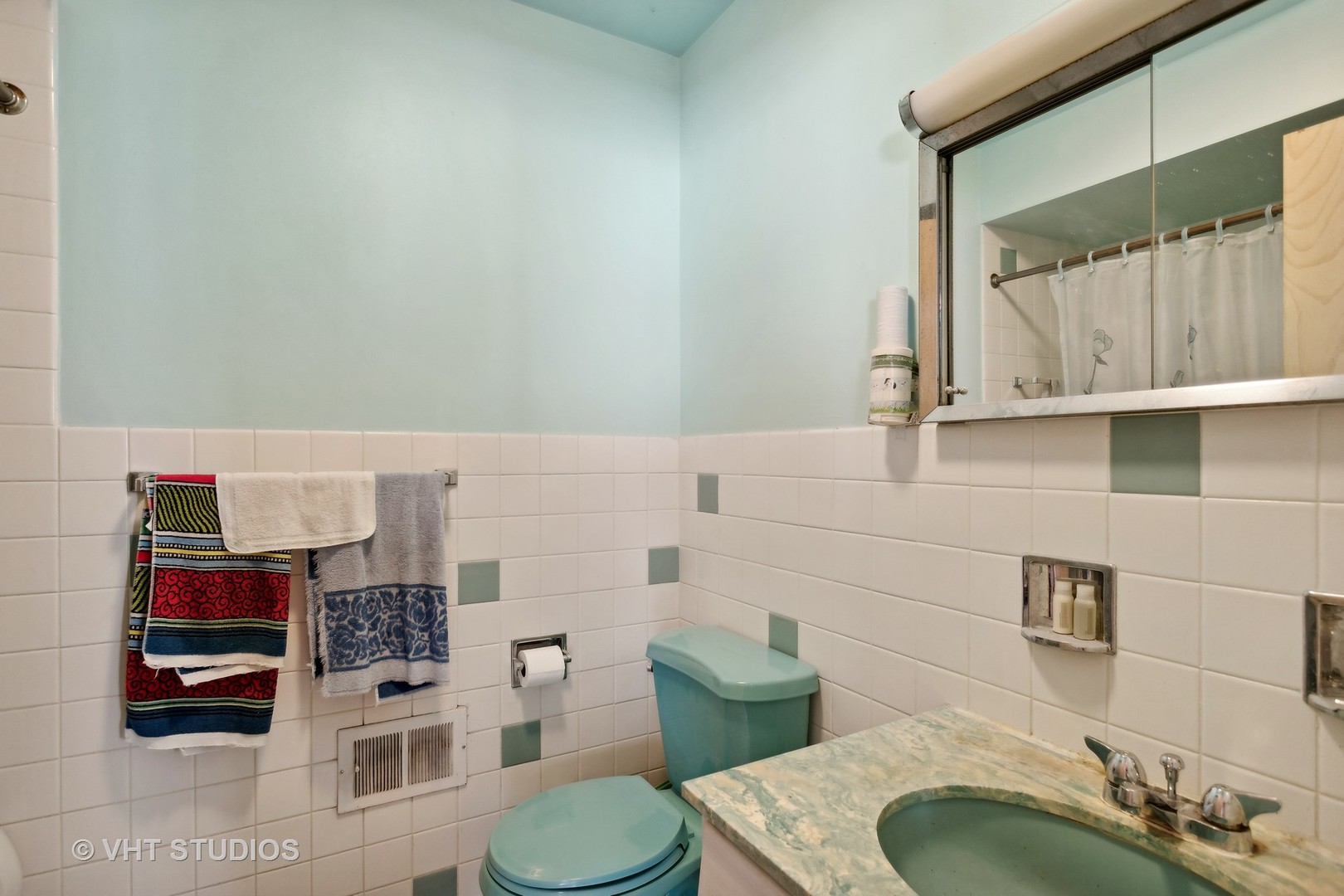 7957 Beckwith Road Morton Grove, IL 60053 - Photo 17 of 26 a bathroom with a sink toilet and shower