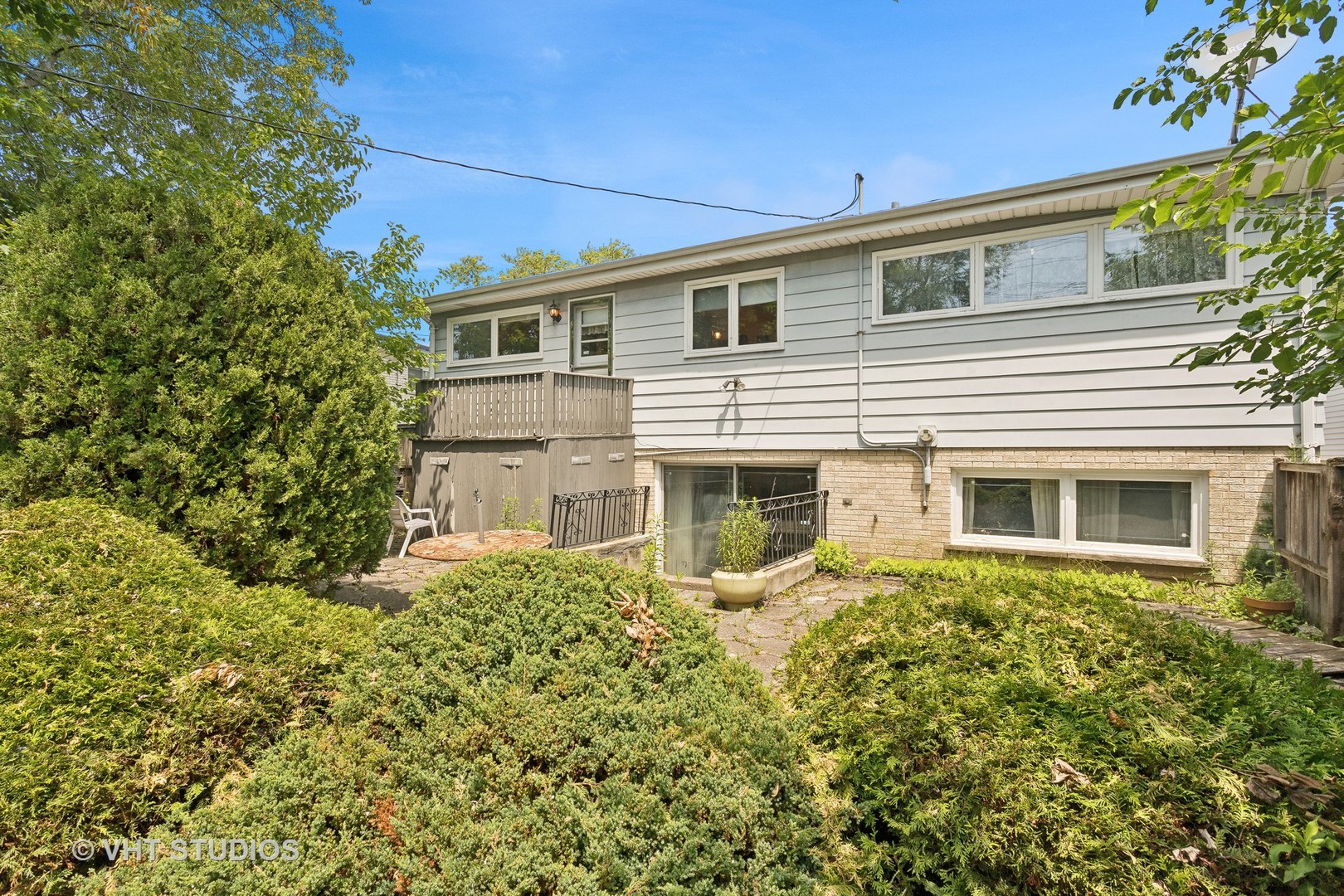 7957 Beckwith Road Morton Grove, IL 60053 - Photo 20 of 26 a front view of a house with a yard