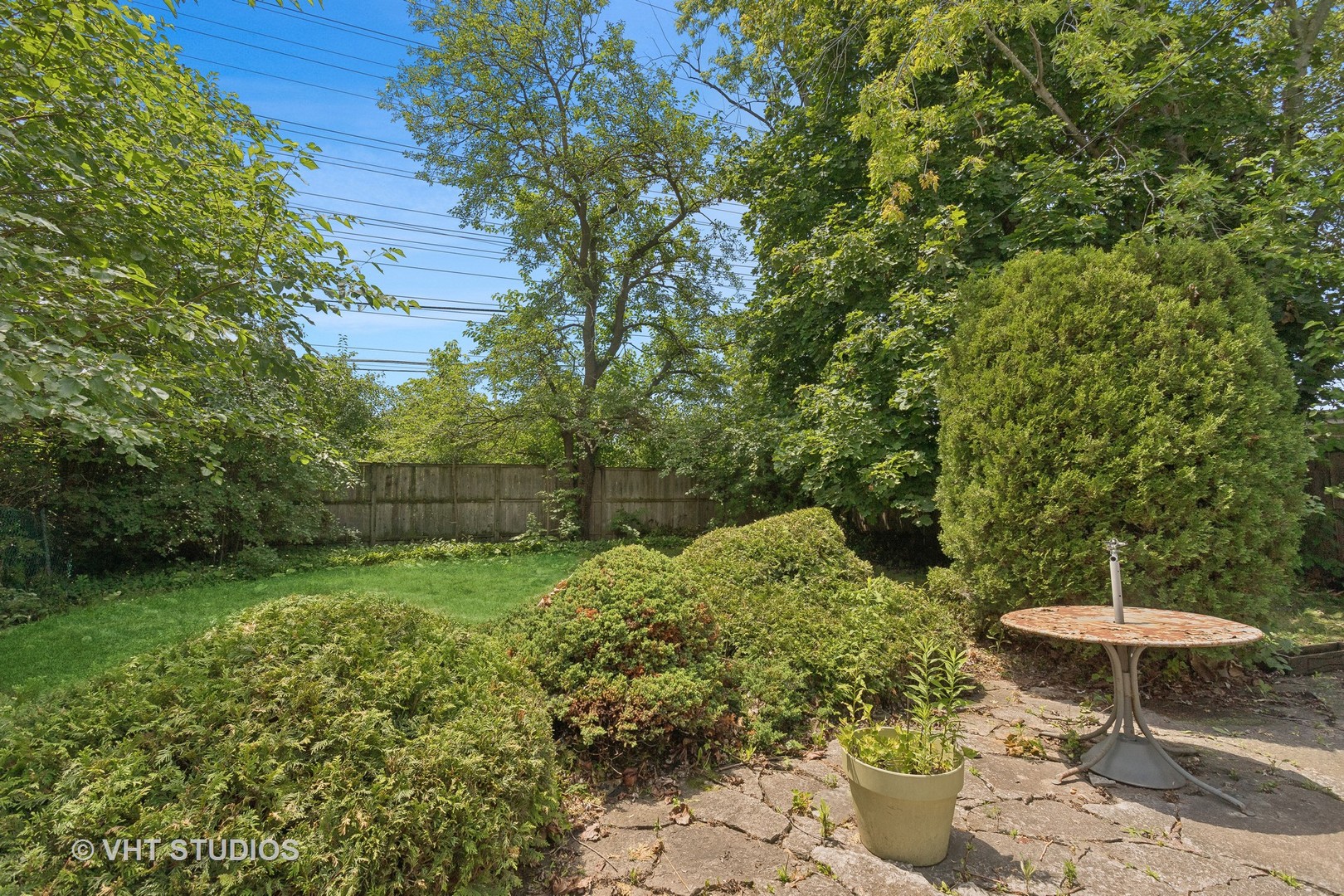 7957 Beckwith Road Morton Grove, IL 60053 - Photo 21 of 26 a backyard of a house with a yard and outdoor seating
