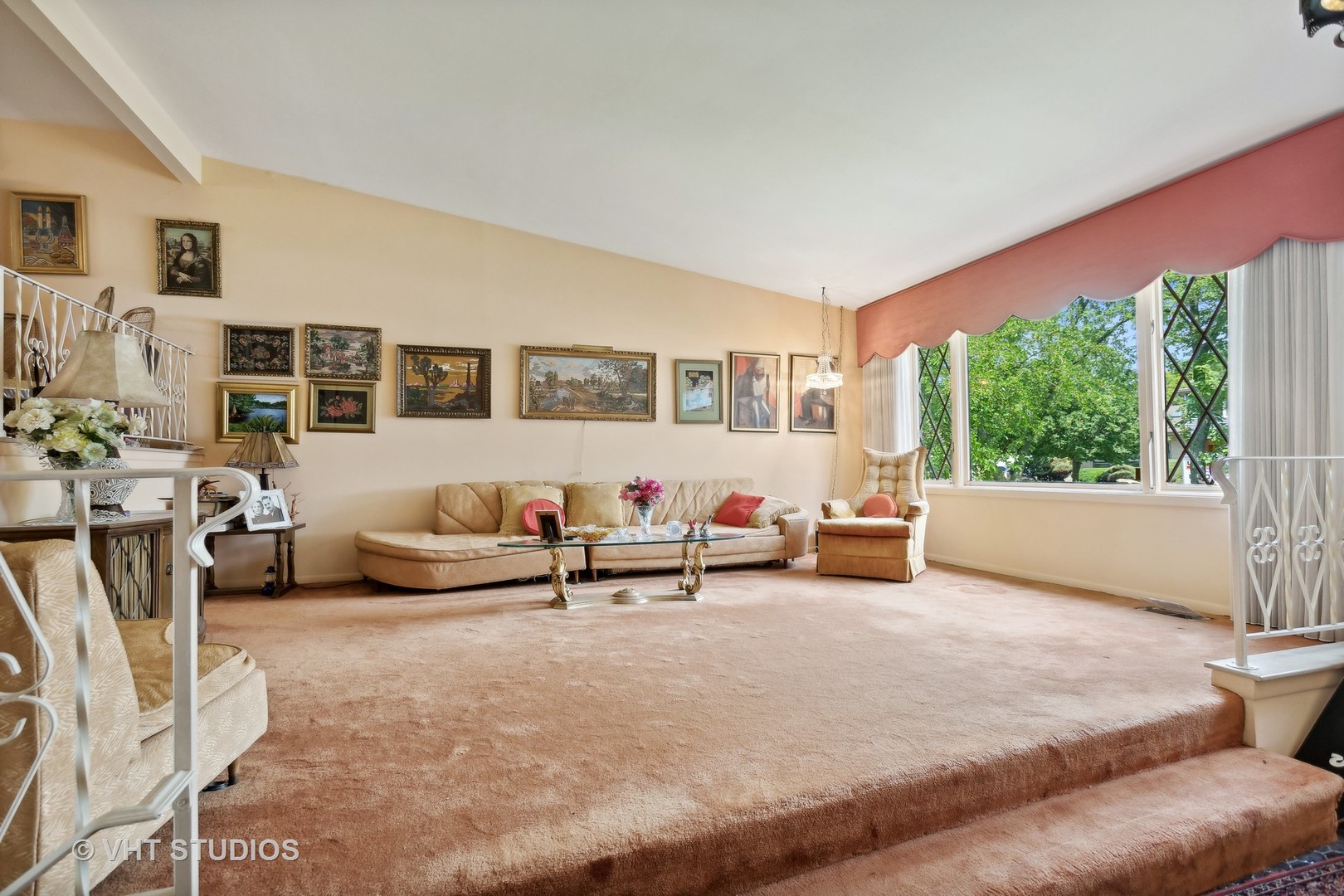 7957 Beckwith Road Morton Grove, IL 60053 - Photo 3 of 26 a living room with furniture and a large window