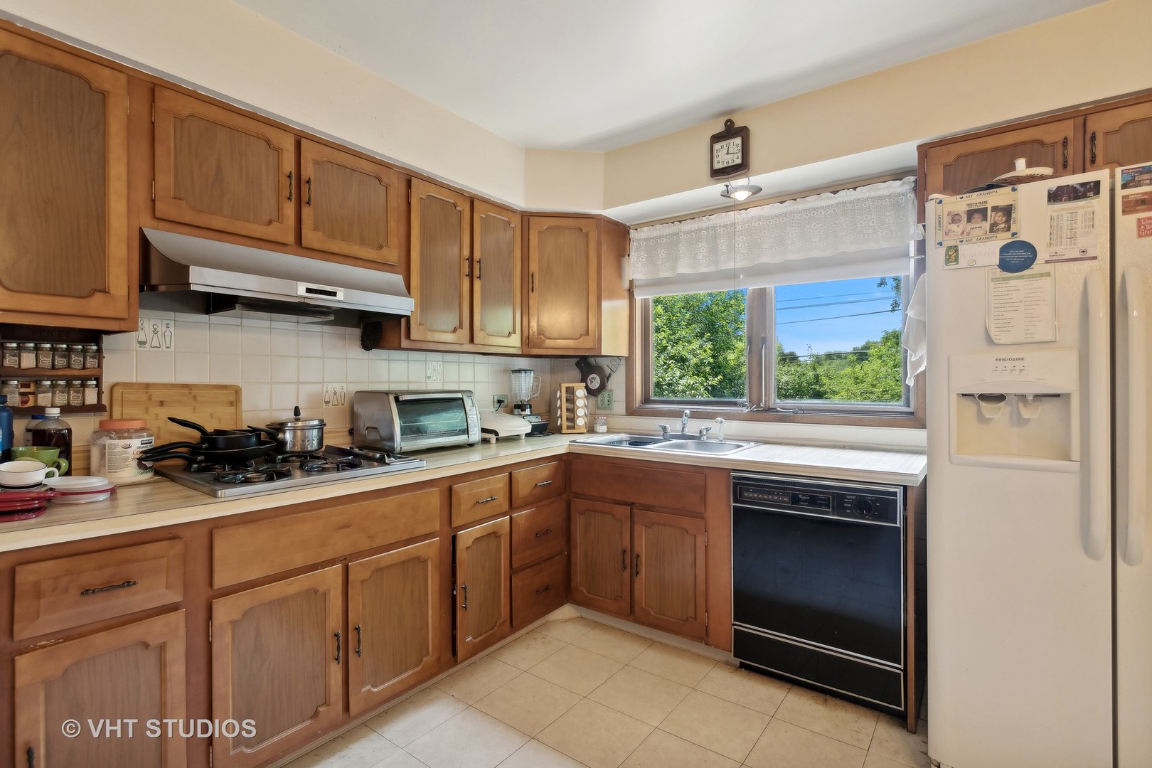 7957 Beckwith Road Morton Grove, IL 60053 - Photo 7 of 26 a kitchen with cabinets appliances and a window