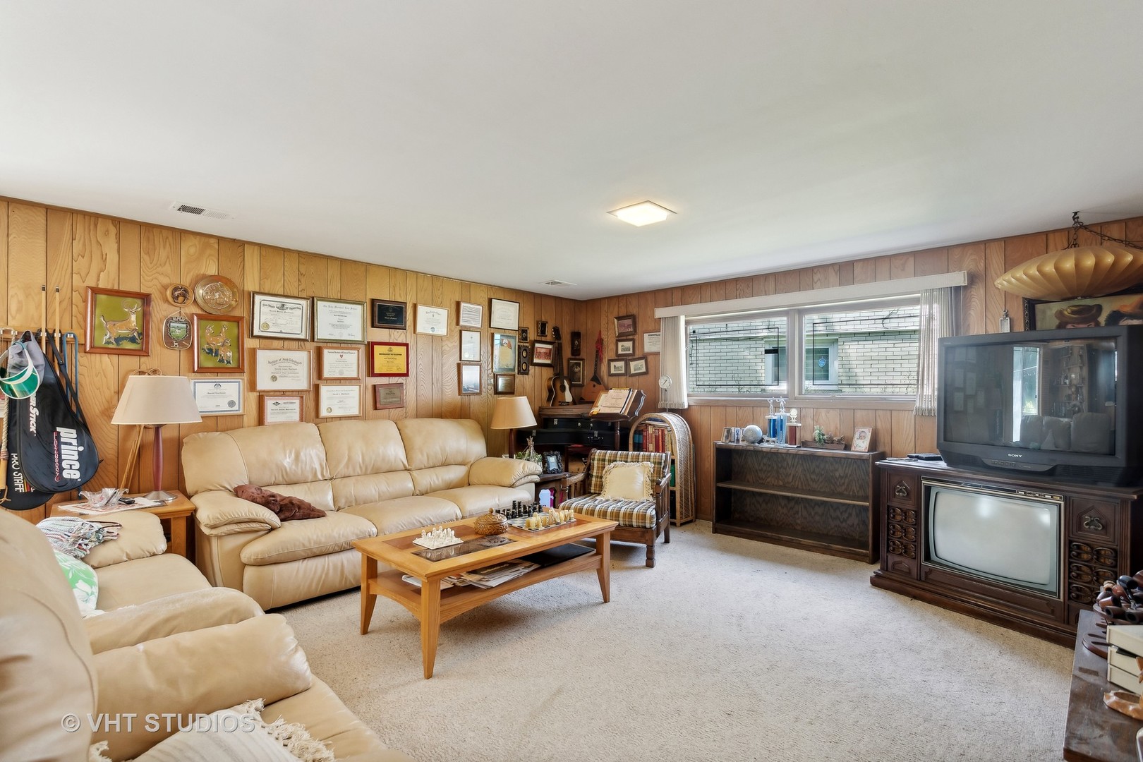 7957 Beckwith Road Morton Grove, IL 60053 - Photo 10 of 26 a living room with furniture and a floor to ceiling window
