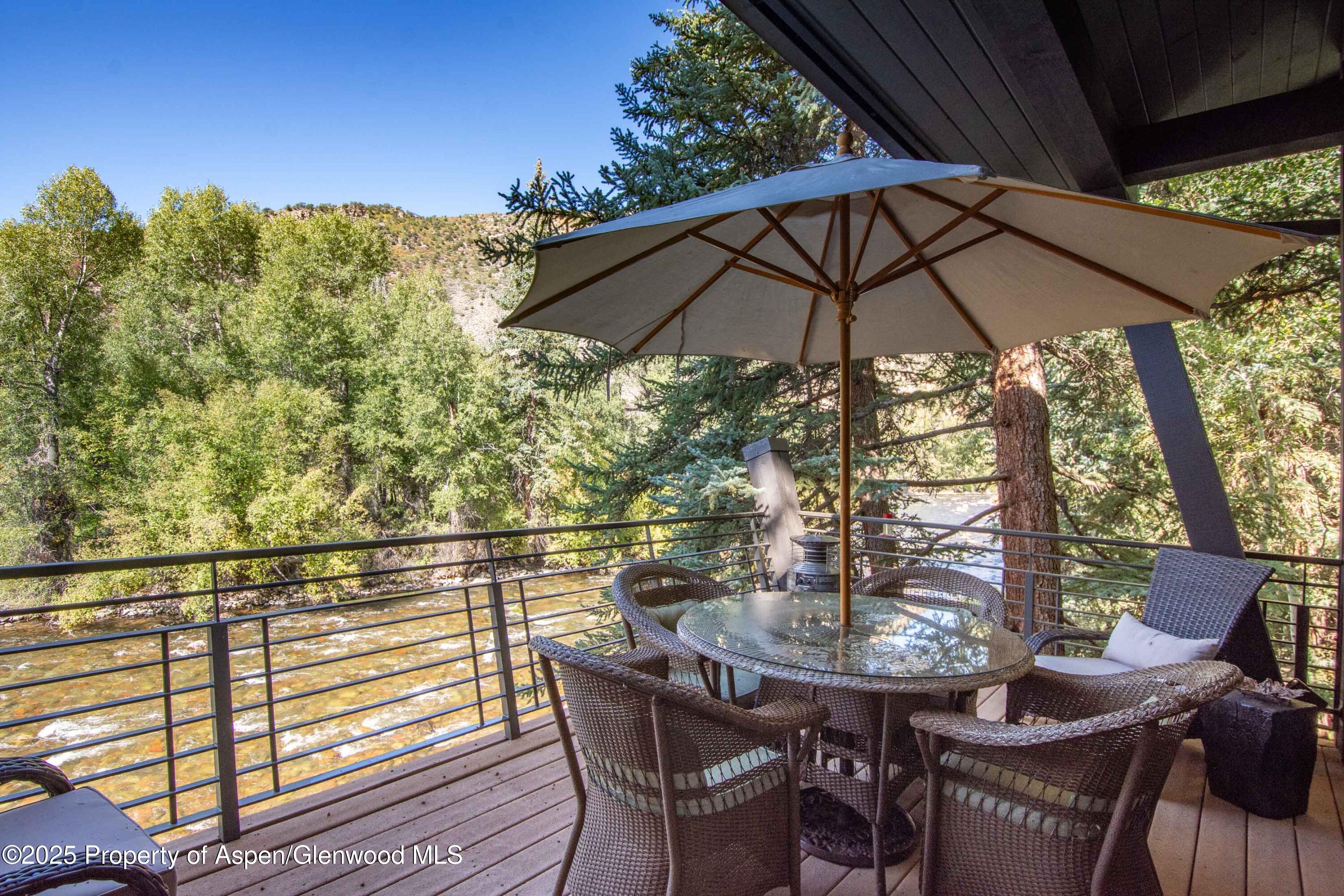 4076 Lower River Road Snowmass, CO 81654 - Photo 20 of 71 a view of a outdoor sitting area with furniture
