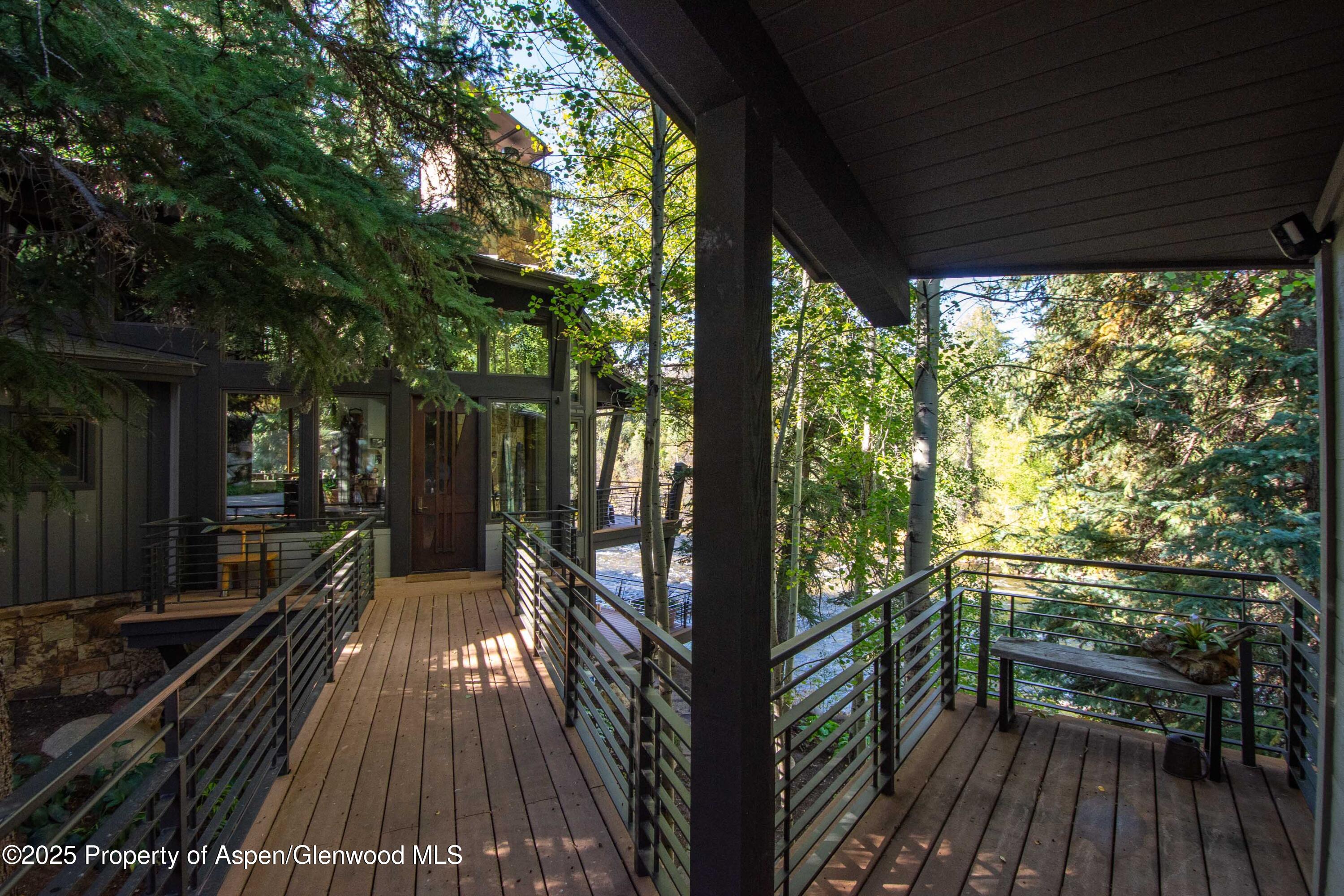 4076 Lower River Road Snowmass, CO 81654 - Photo 24 of 71 a view of balcony with wooden floor and outdoor space