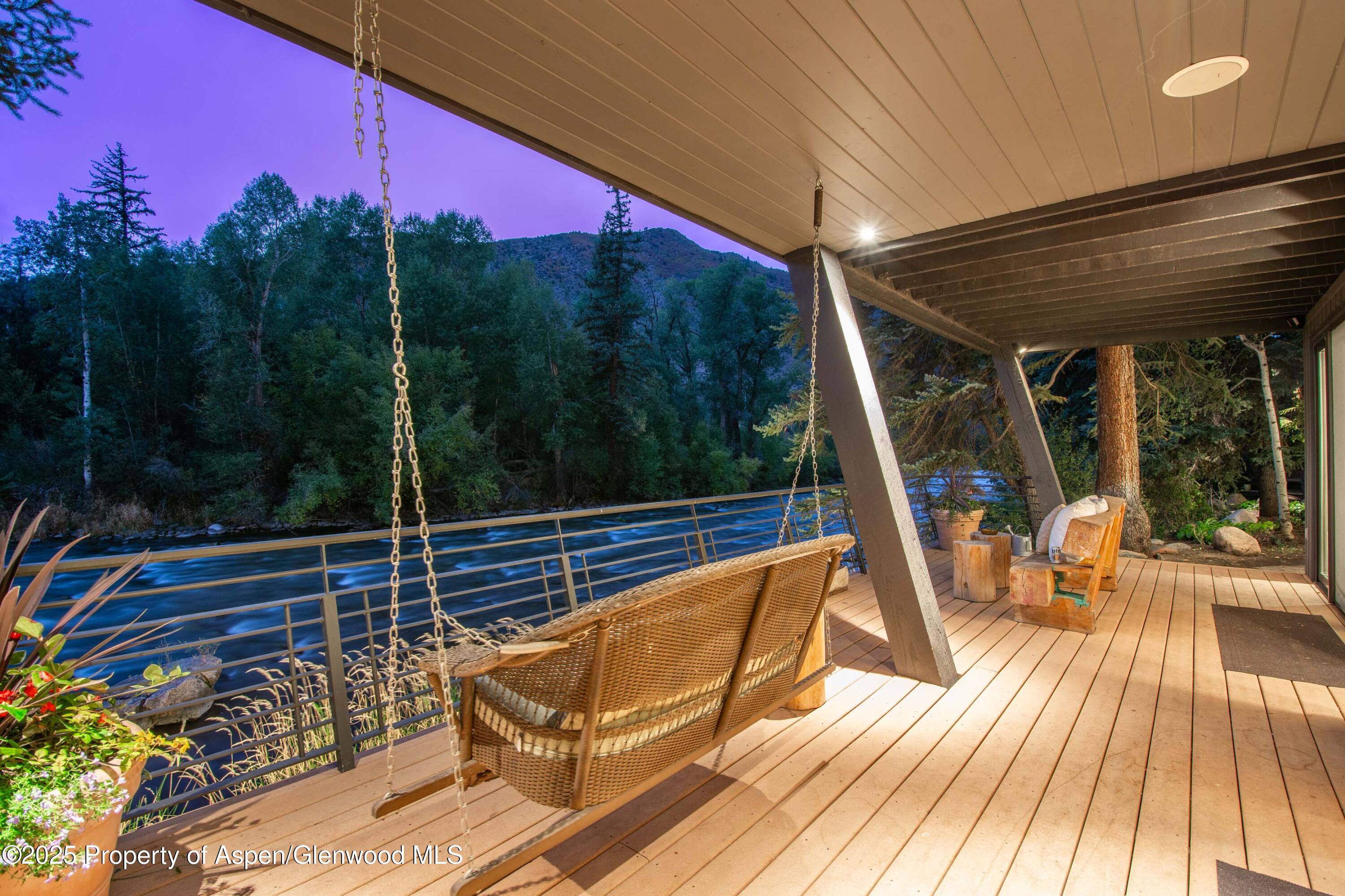4076 Lower River Road Snowmass, CO 81654 - Photo 3 of 71 a view of a two chairs in the balcony