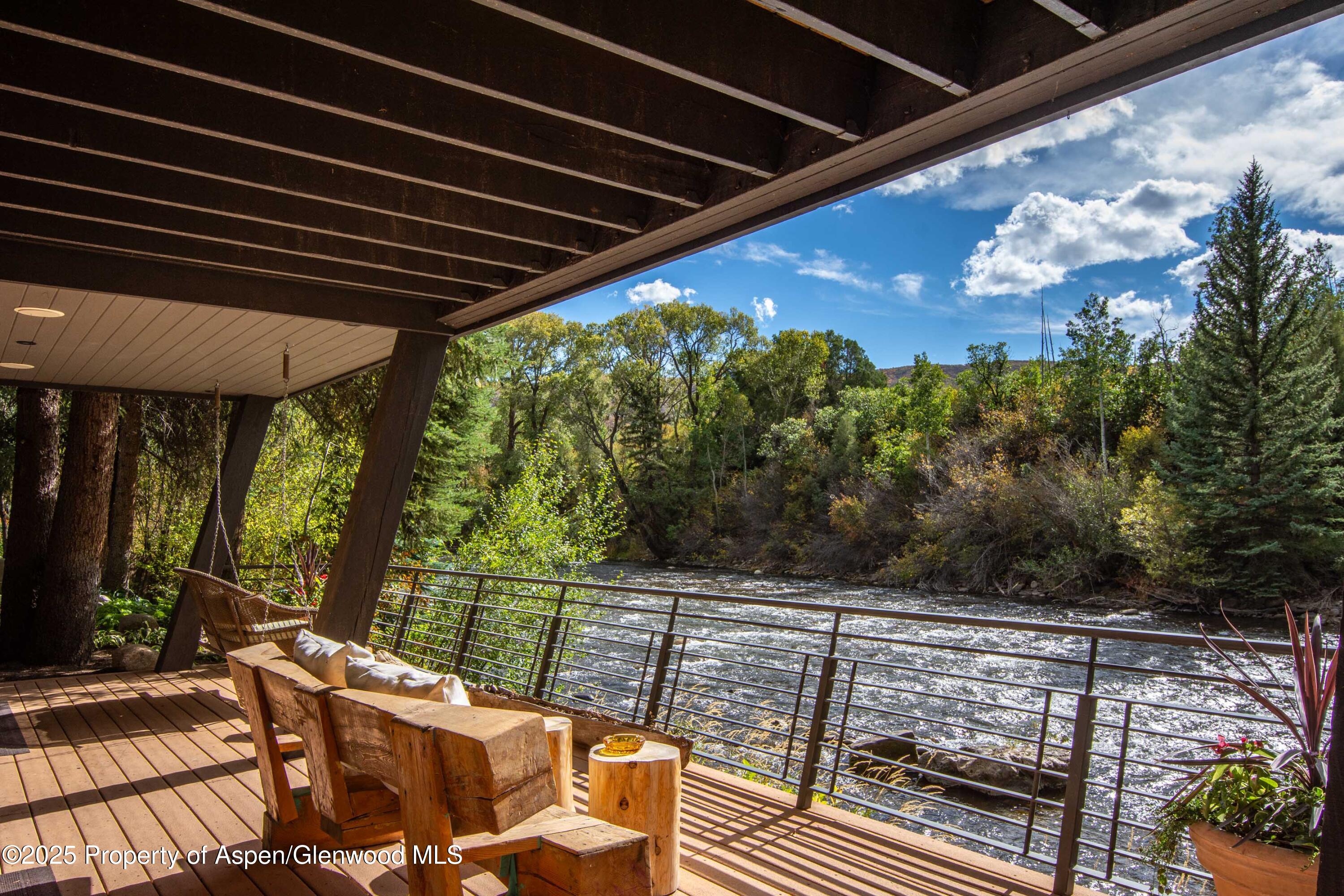 4076 Lower River Road Snowmass, CO 81654 - Photo 42 of 71 a view of a balcony with furniture