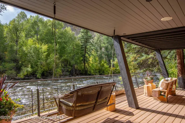 a view of a patio in a backyard