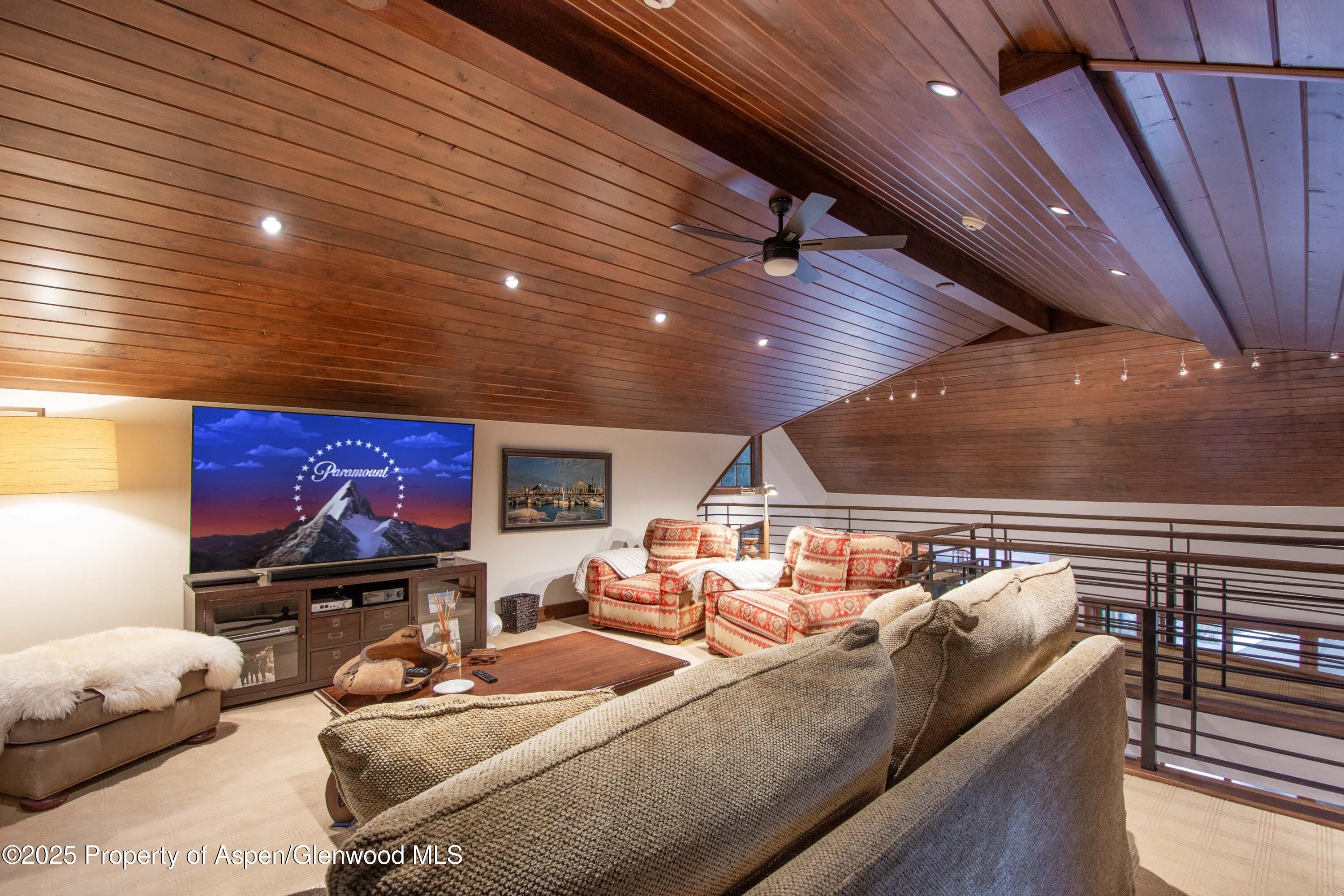 4076 Lower River Road Snowmass, CO 81654 - Photo 45 of 71 a living room with furniture