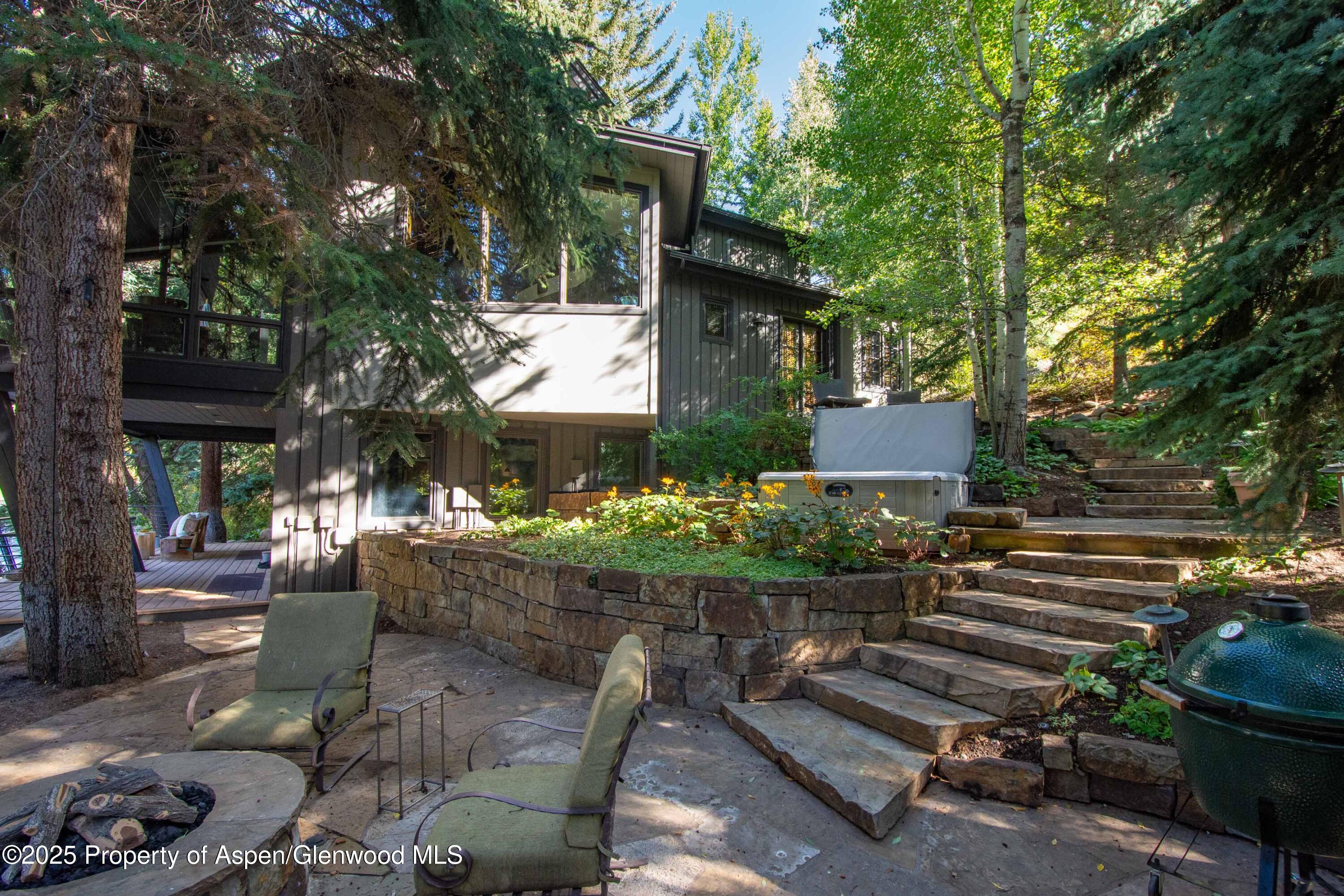 4076 Lower River Road Snowmass, CO 81654 - Photo 57 of 71 a view of backyard with outdoor seating and plants