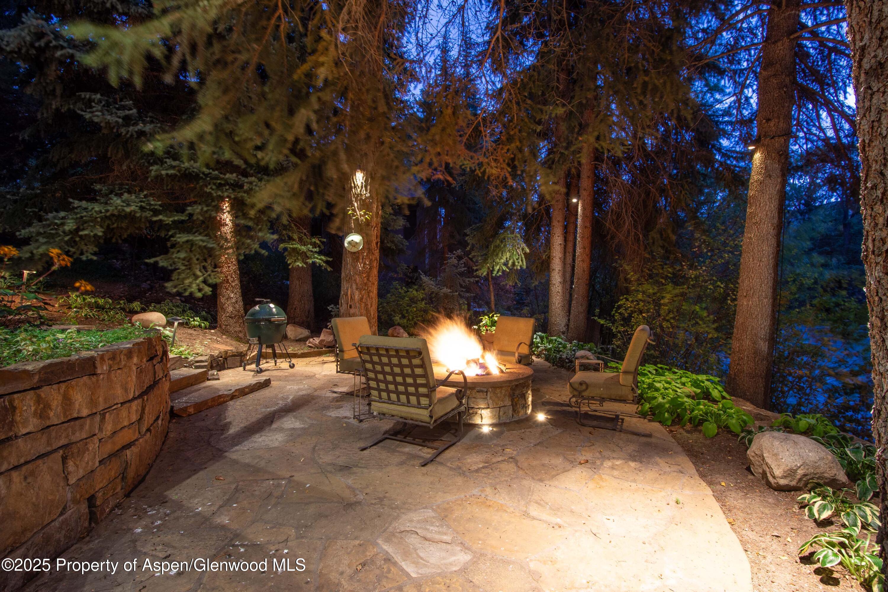 4076 Lower River Road Snowmass, CO 81654 - Photo 6 of 71 a view of a bench in a backyard