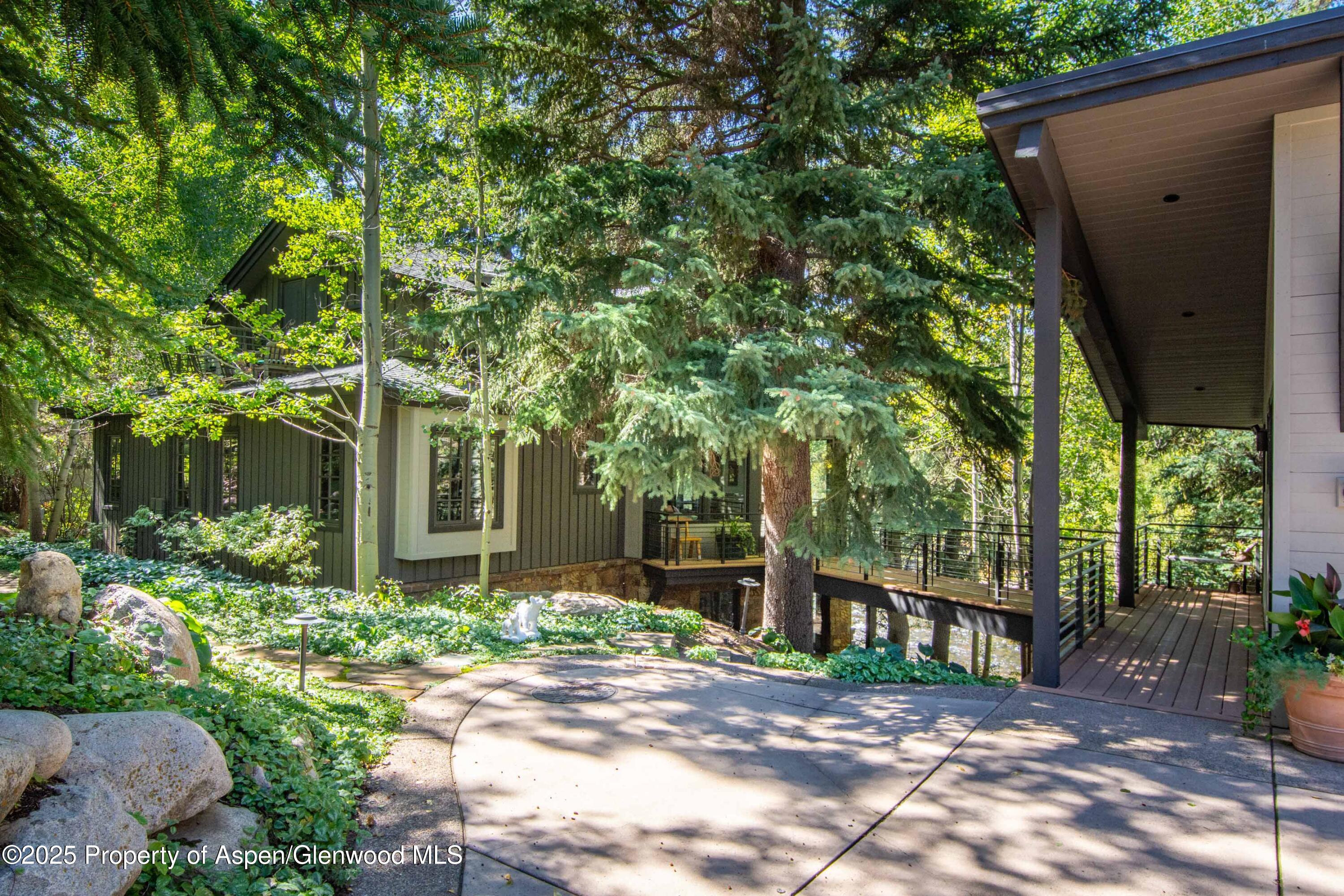 4076 Lower River Road Snowmass, CO 81654 - Photo 69 of 71 a view of a house with a yard