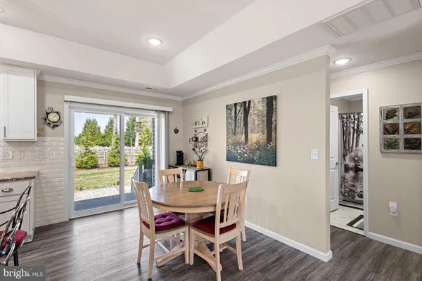 a dining room with furniture window wooden floor