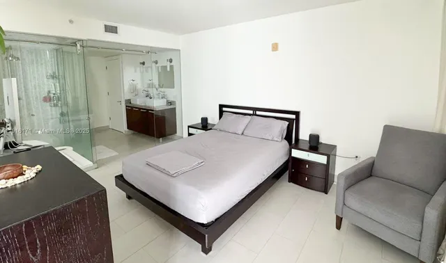 a bed room with a bed and a couch