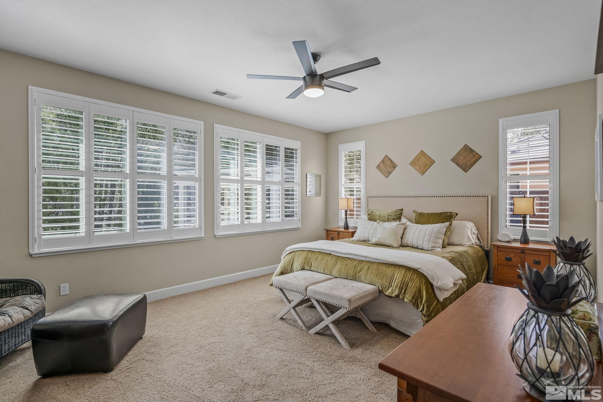 8180 Willow Ranch Trail Reno, NV 89523 - Photo 16 of 31 a bedroom with a bed and a couch