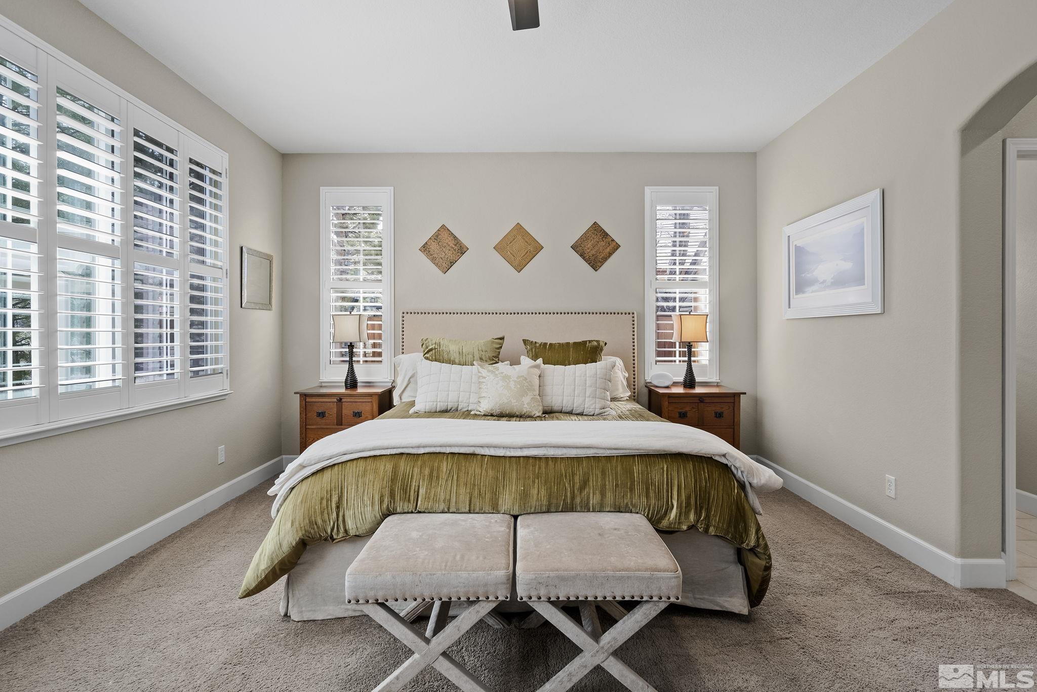 8180 Willow Ranch Trail Reno, NV 89523 - Photo 17 of 31 a bedroom with a bed and a painting on the wall