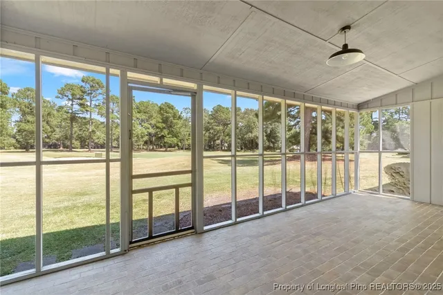 a view of an empty room with windows