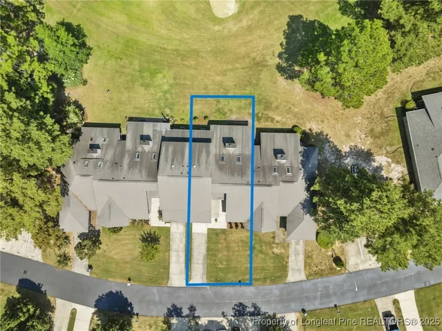 aerial view of a house with a yard