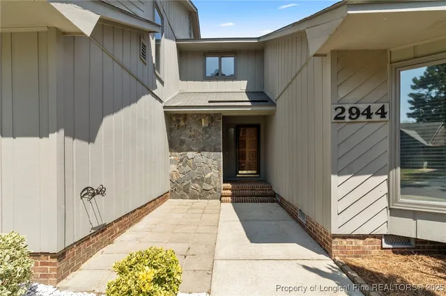 a bath room with a wooden door