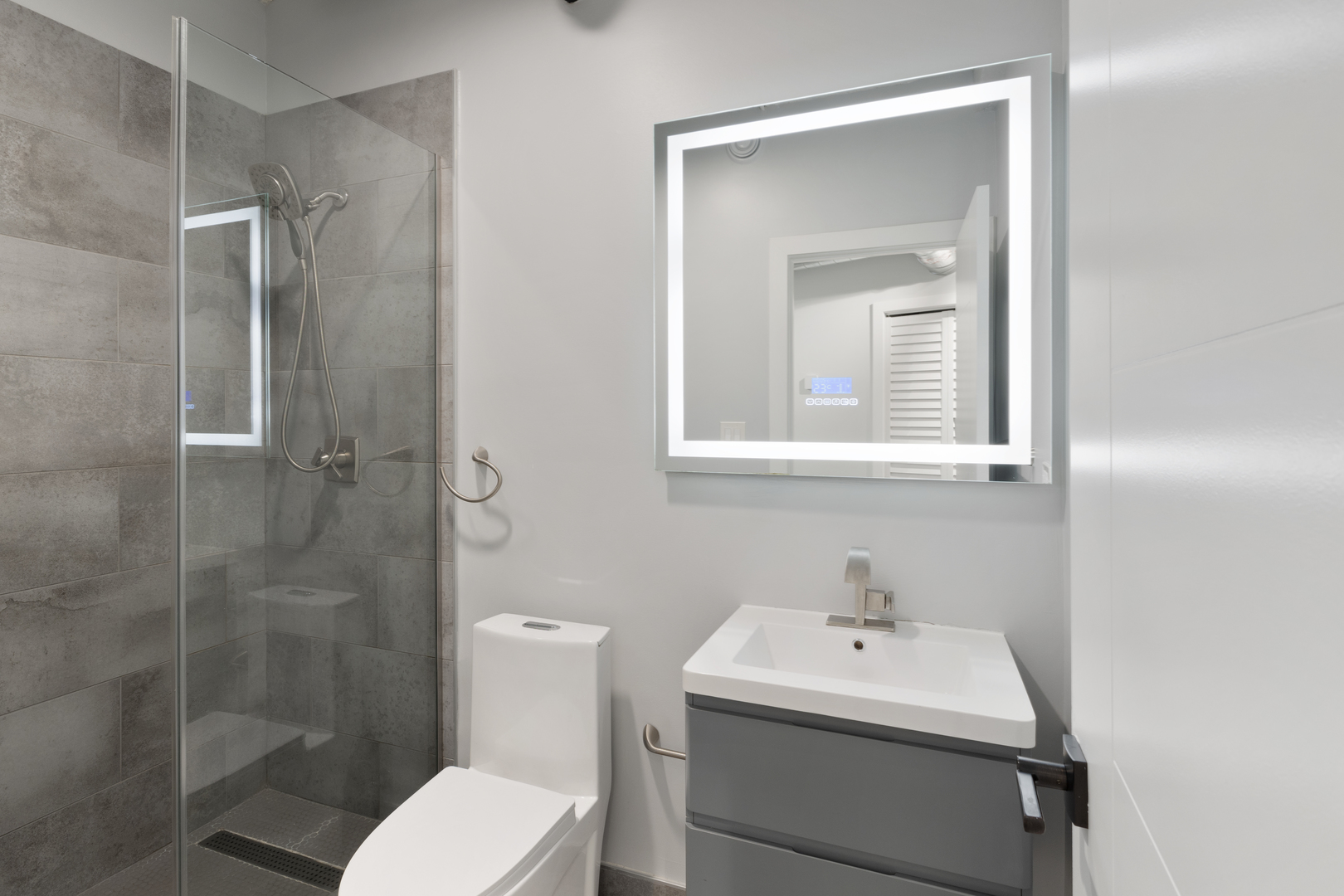 7645 North Sheridan Road, Unit 514 Chicago, IL 60626 - Photo 12 of 17 a bathroom with a sink toilet and shower