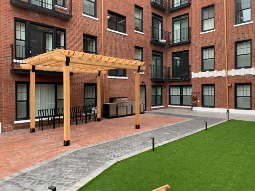 7645 North Sheridan Road, Unit 514 Chicago, IL 60626 - Photo 14 of 17 a view of a building with a yard