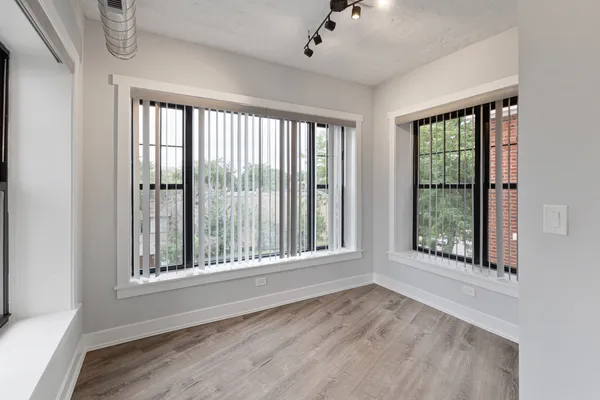 a view of an empty room with a window