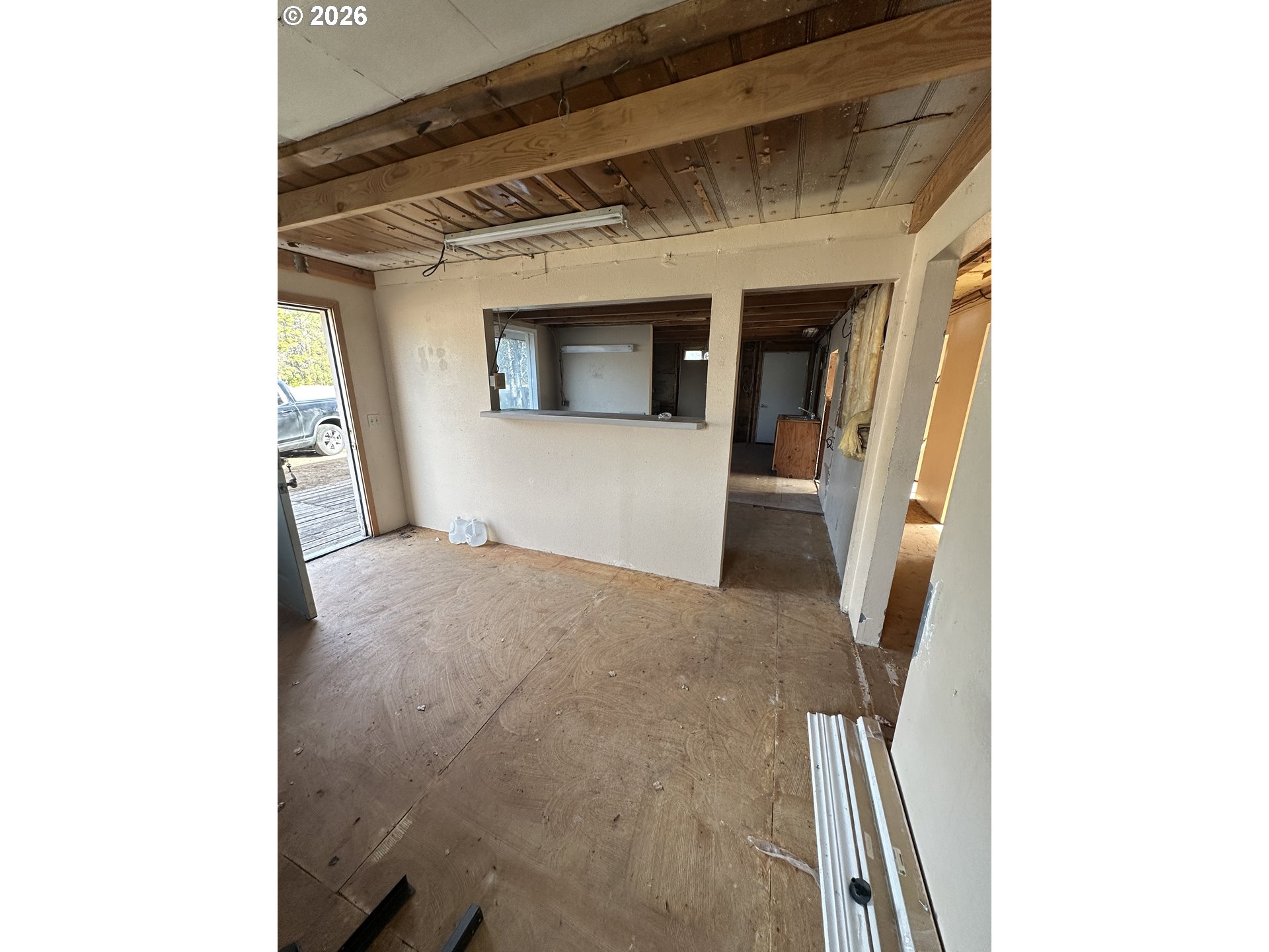 136863 Highway 97 Crescent, OR 97733 - Photo 18 of 19 a view of a hallway with wooden floor and a large window
