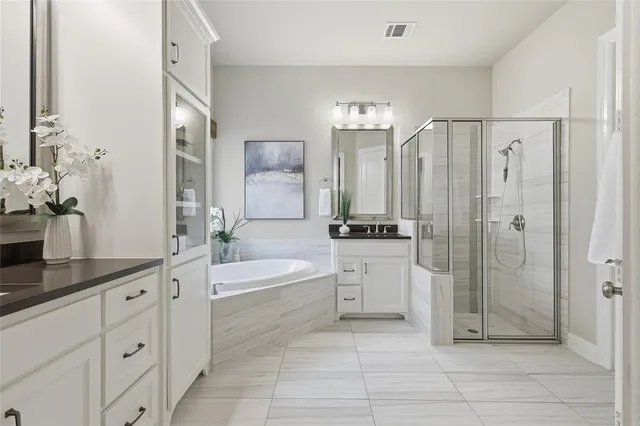 a bath room with a sink and a mirror