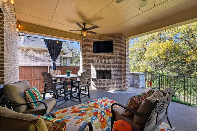 a terrace with a sink and wooden fence