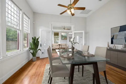 a living room with stainless steel appliances granite countertop furniture and a fireplace
