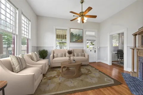 wooden floor in an empty room with a window