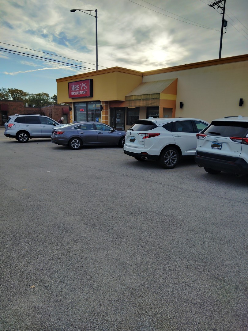 a view of cars parked in front of a building
