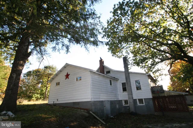front view of a house with a tree