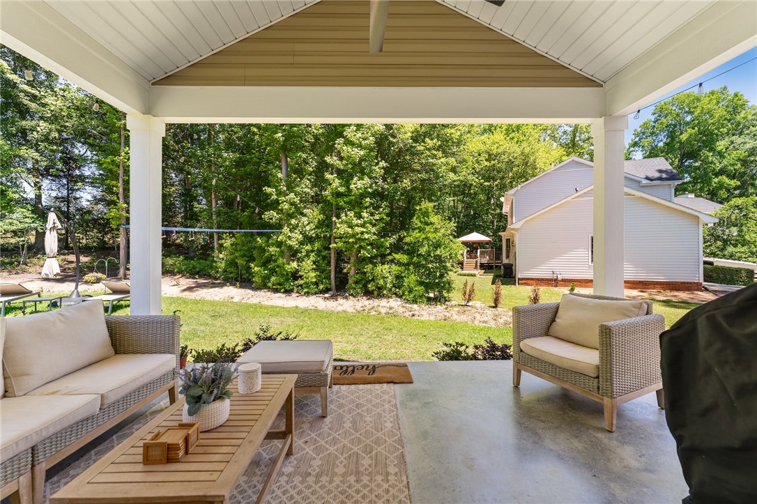 502 Canebrake Drive Anderson, SC 29621 - Photo 37 of 39 This inviting covered porch provides a tranquil outdoor retreat with ample space for relaxation.